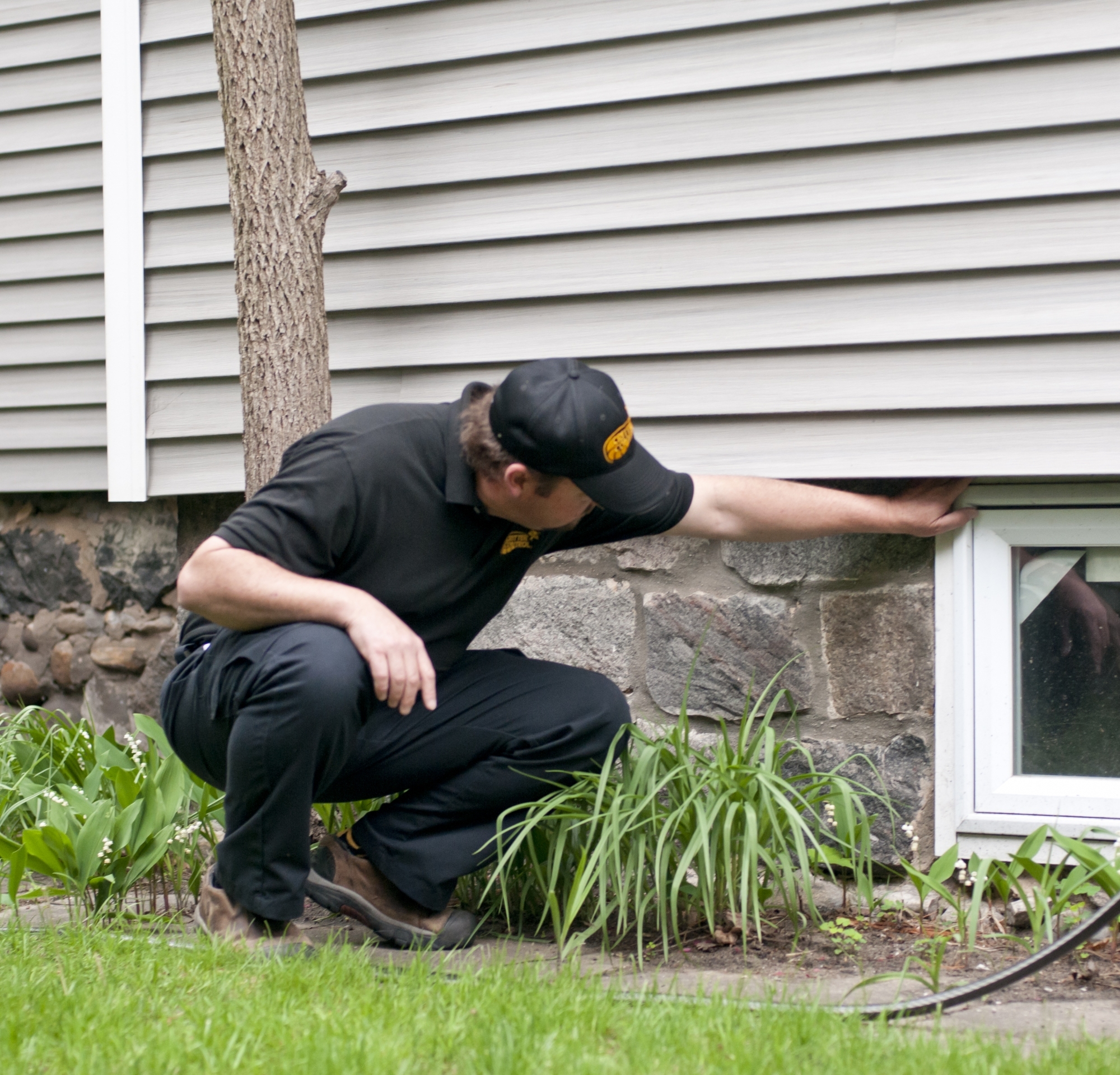 Critter Control of Seattle Technician Inspecting Seattle Home Foundation